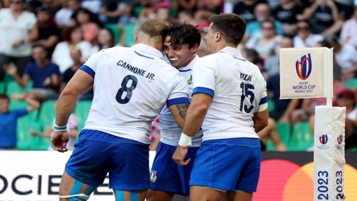Italy celebrate scoring a try 